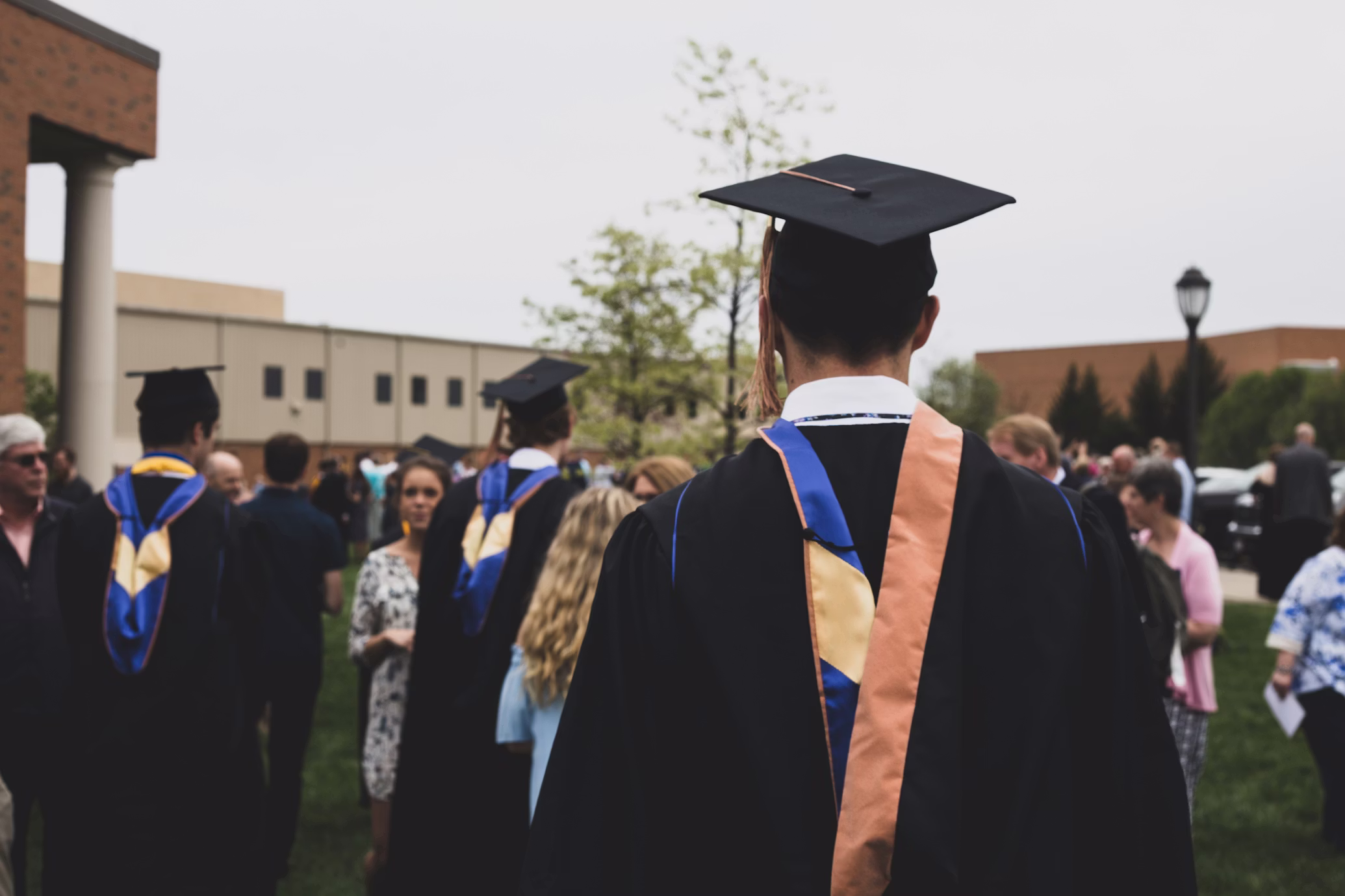Male graduate smiling